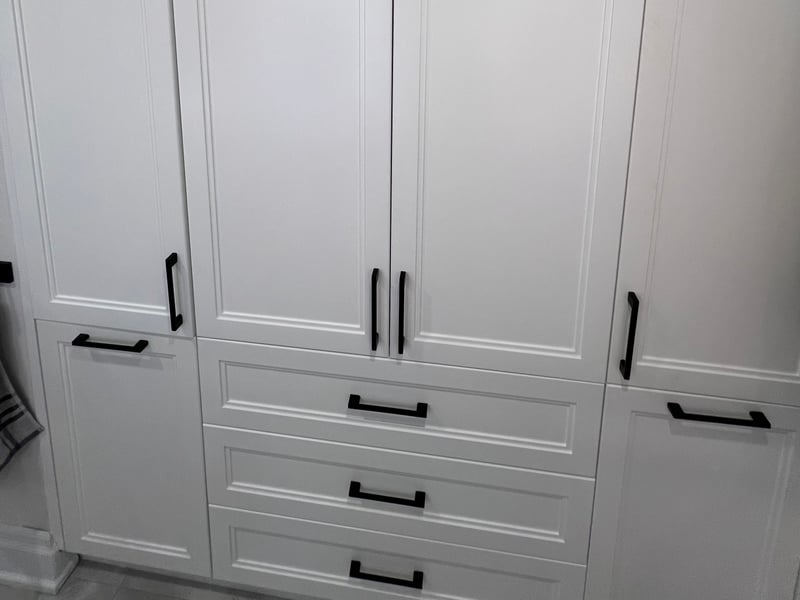 Full-height closed cabinetry with a central drawer stack, built in the Mississauga workshop — October 2026 catalogue