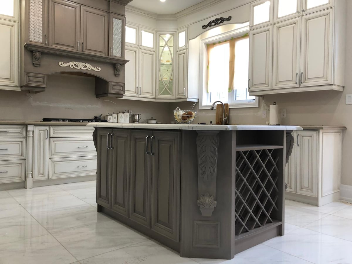 Island with a wine-rack end panel in a grey traditional kitchen